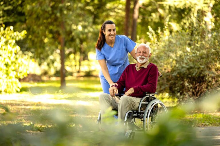 A senior resident decorating their own room with family photos and favorite keepsakes.
